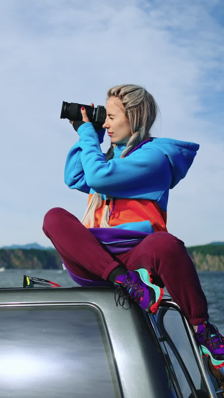 Young Woman Photographer Taking Pictures Outdoors on a Boat