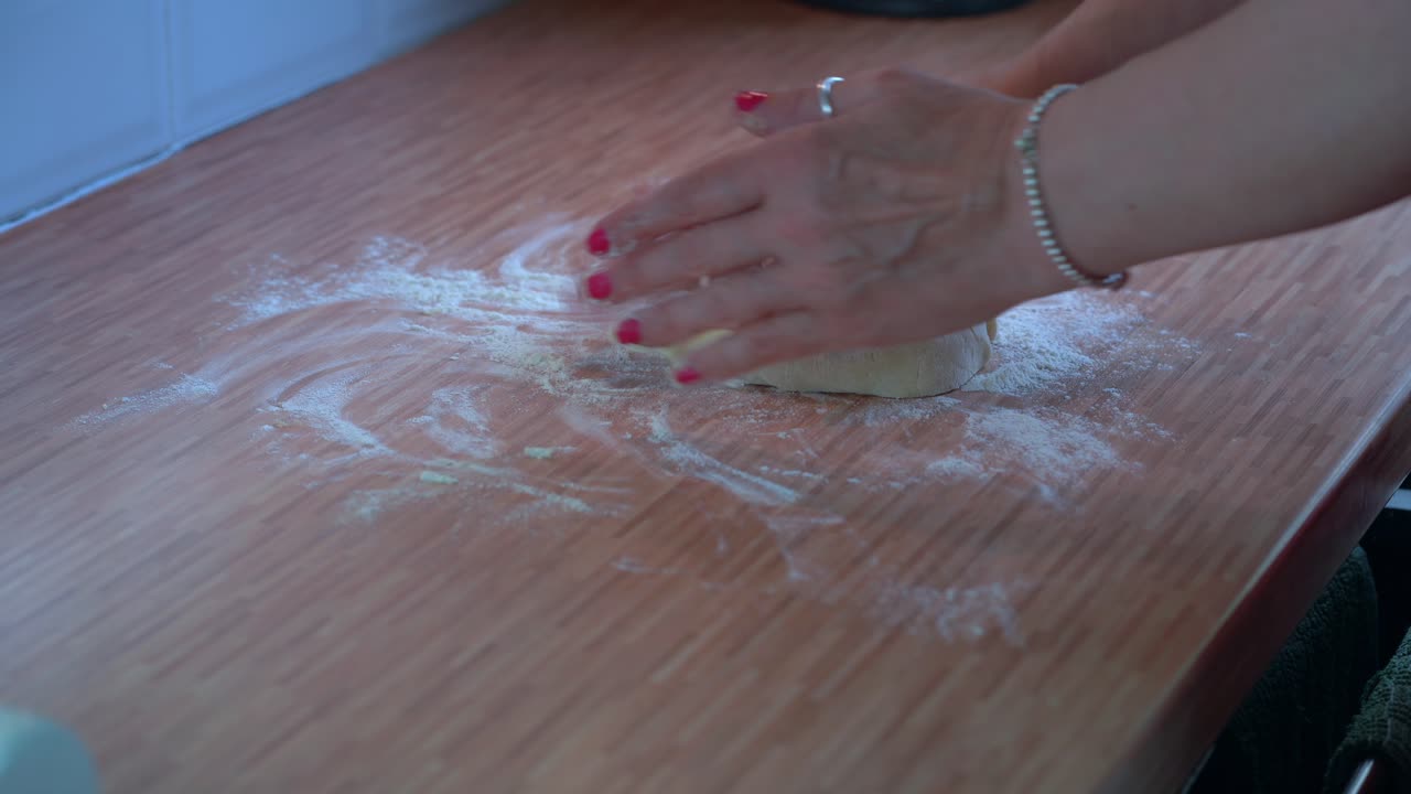 Female hands forming scone mixture on counter top