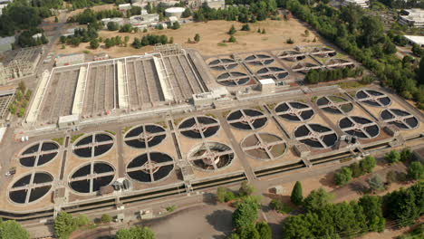 circling aerial shot over american waste water treatment plant