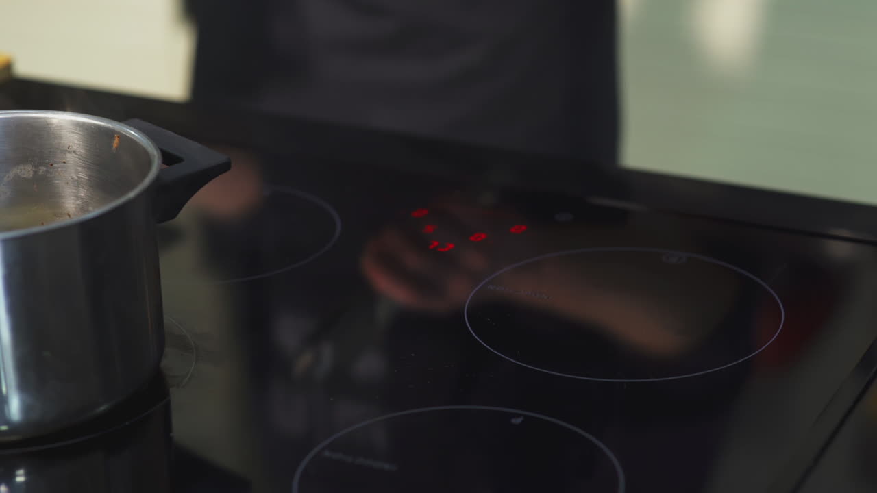 Chef Adjusting Stovetop