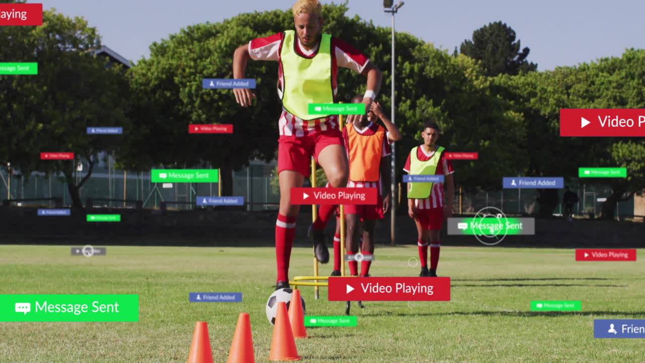 Training on grassy field, soccer players with digital notifications and animation