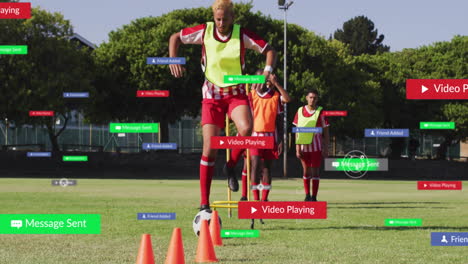 training on grassy field, soccer players with digital notifications and animation