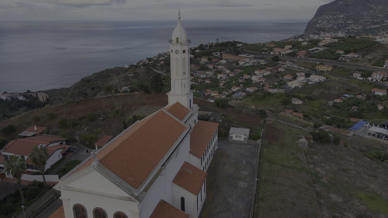 Fantastic aerial view of the Church of Sao Martinho on Madeira Island, Portugal during a beautiful sunset