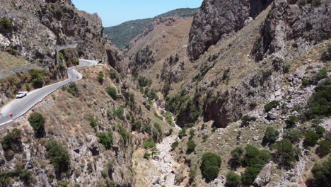 dry river between steep walls of narrow canyon at topolia gorge in crete, greece