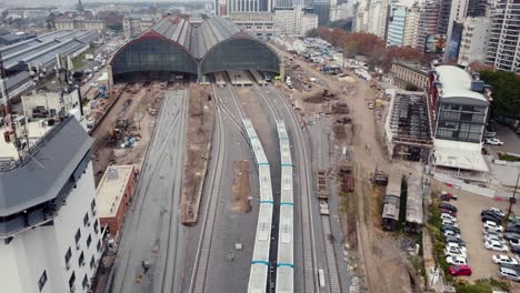 two trains arrive at same time to buenos aires retiro station, aerial