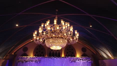 view of a beautiful chandelier at a wedding venue in a hotel