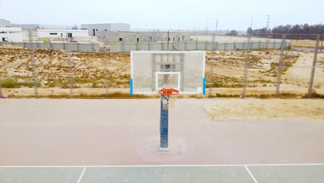 quick flight to the direction of transparent basketball board at desert