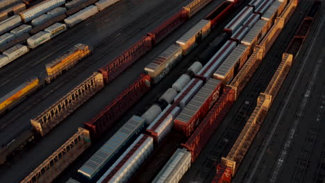 tight aerial shot over busy freight train yard