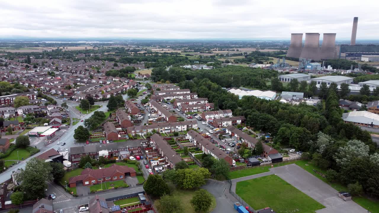 Aerial View of a Residential Area with a Power Plant in the Background