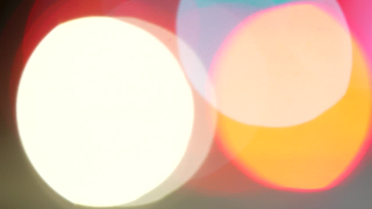 Colorful defocused bokeh background. Shiny glow, glitter light effect. Bokeh circle background.