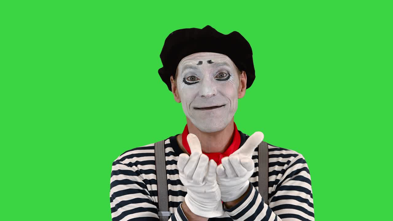 mime enviándote su corazón en una pantalla verde, clave de croma