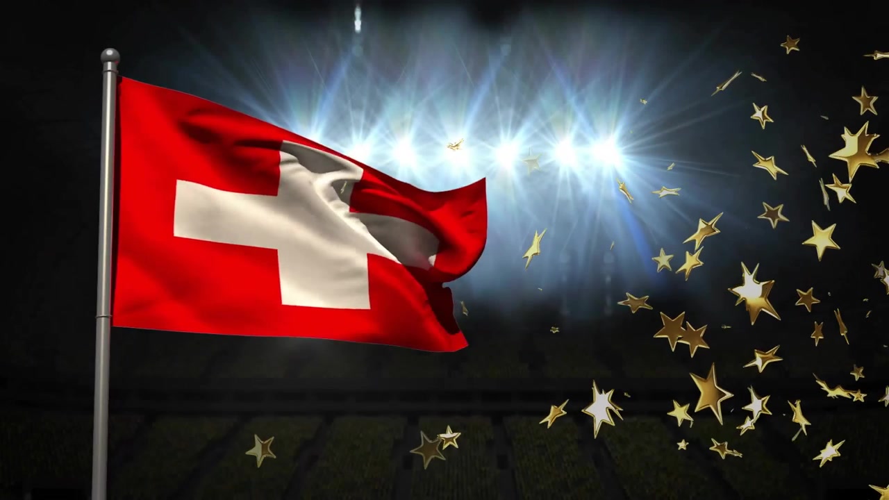 Windböen lassen Schweizer Flagge wehen, während goldene Sterne über einem flutlichtbeleuchteten Stadion schweben.