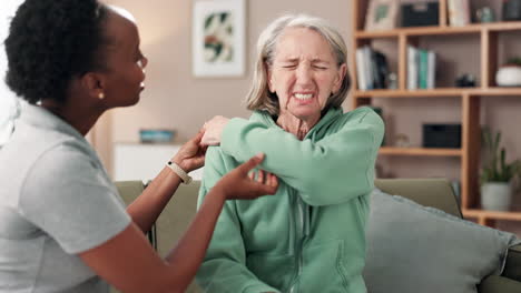 physical therapist helping senior woman with pain