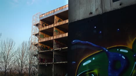 Graffiti-on-skeletal-hospital-building-ruins,-Zagreb,-Croatia