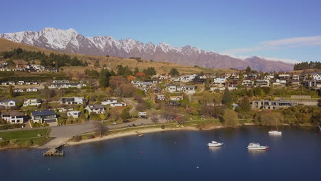 Yachts-moored-in-the-bay-of-Queenstown-with-in-the-background-the-high-Remarkables-mountain-range