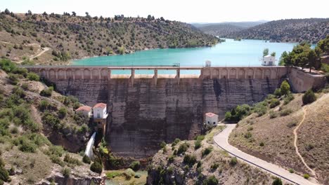 embalse del arquillo de san blas, teruel, aragon, spain - aerial drone view of the dam lake and turquoise water reservoir