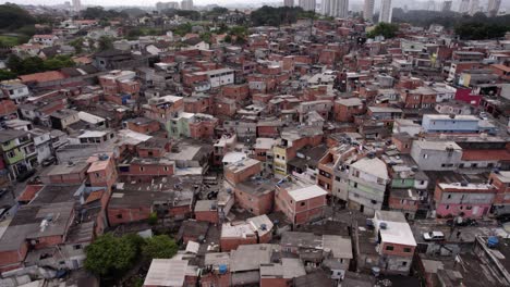 Aerial view of a poor community in Sao Paulo, Brazil - descending, tilt, drone shot