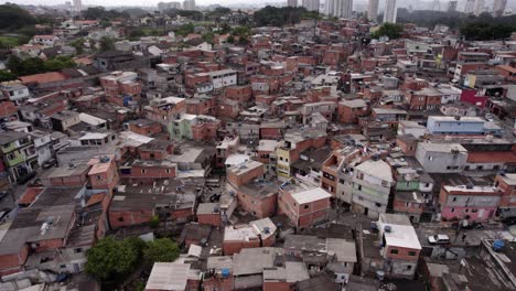 aerial view of a poor community in sao paulo, brazil - descending, tilt, drone shot