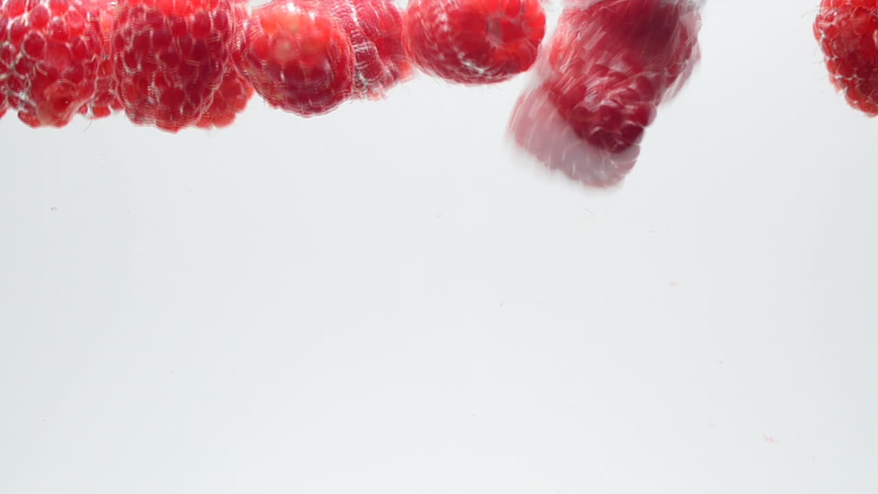 Raspberry on a white background. Shooting on a white background