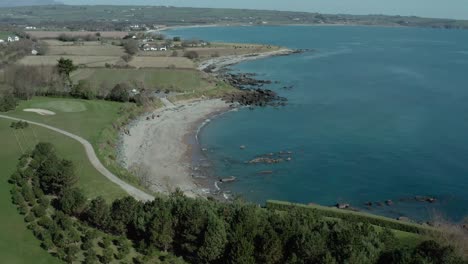 Wide-angle-birds-eye-view-of-sea-coast-at-day-establishing-shot