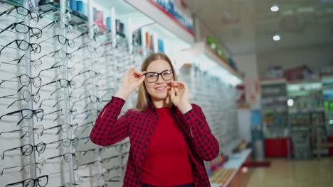 woman trying glasses. view of young attractive woman testing new glasses