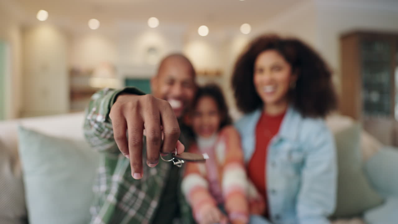 Happy Family with Keys to New Home