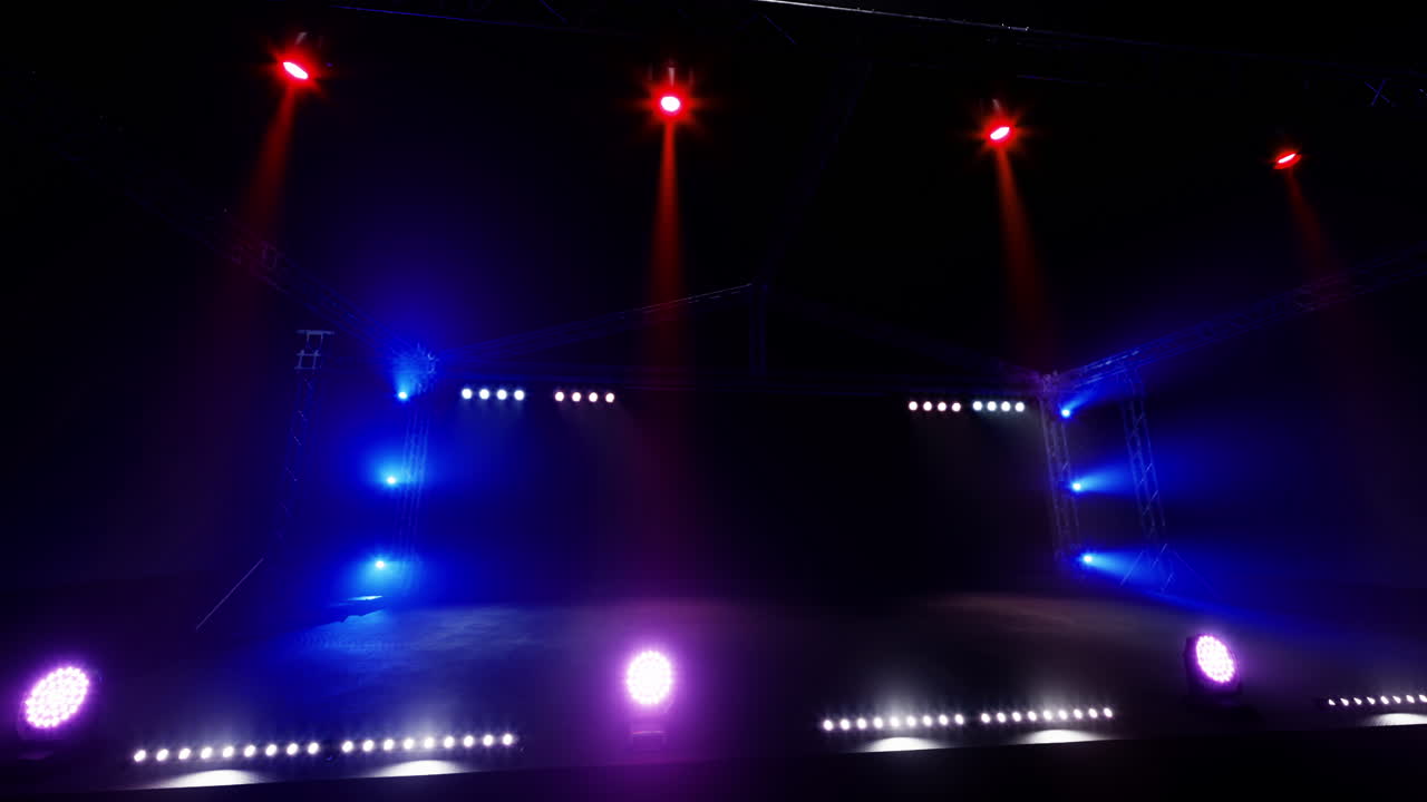 Lighting setup for a concert stage creates vibrant atmosphere before show