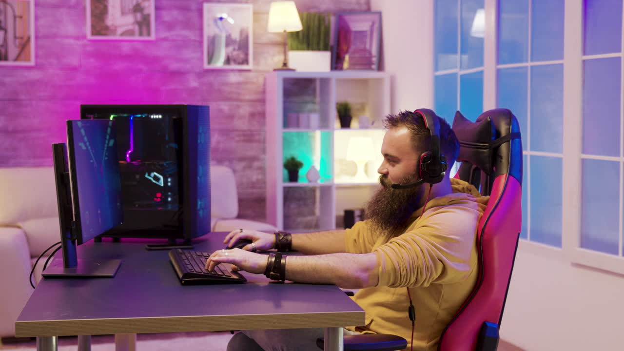 Gamer playing video games on computer