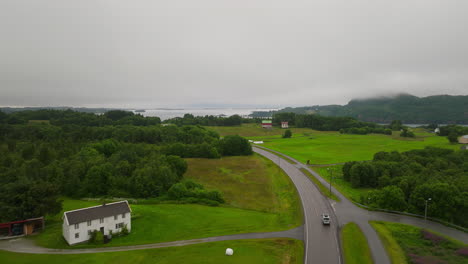 aerial tracking footage of vehicle travelling along norwegian highway