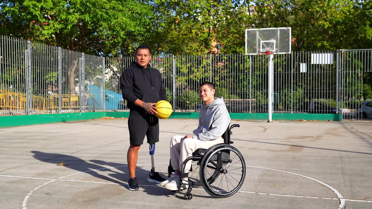 Friends playing basketball with disability and amputation
