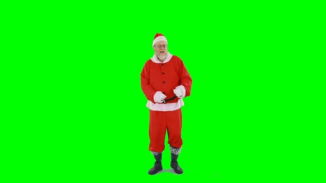 Santa-claus-dancing-against-green-background