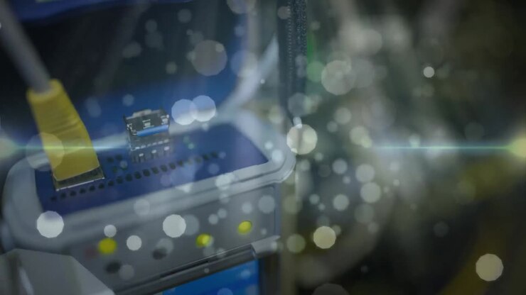Animation of lights and dots floating over computer wires