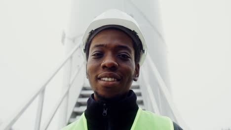 smiling construction worker at industrial facility