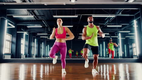 couple dancing in a gym fitness class