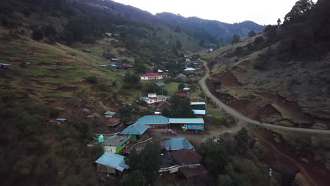 Aerial-shot-of-houses-on-the-rocky-mountains-of-Nebaj,-Quiche-in-Guatemala,-during-the-morning