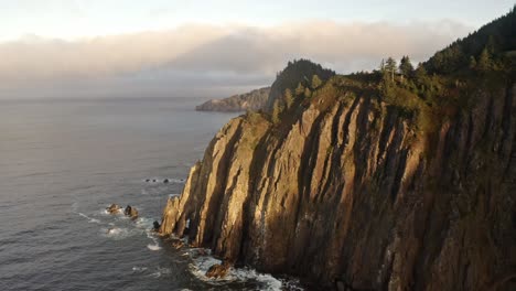 drone shot of a mountain and the sea