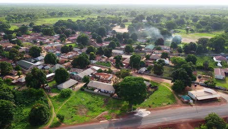 aerial sliding shot of rooftops with solar panels in nuimi lameng village in the gambia