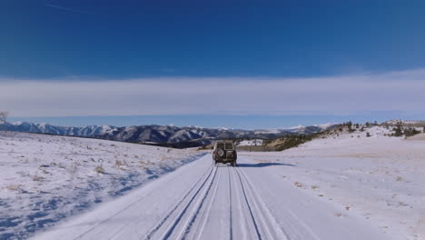 Drone-Aerial-Colorado-Mountains-winter-snowy-forest-road