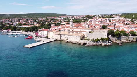 Krk-Village-at-Krk-Island,-Croatia---Aerial-Drone-View-of-the-Cityscape-with-Church,-Cathedral,-City-Walls,-Port,-Boulevard-and-the-Adriatic-Sea