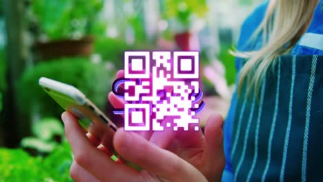 Animation-of-qr-code-and-sale-text-over-woman-with-smartphone