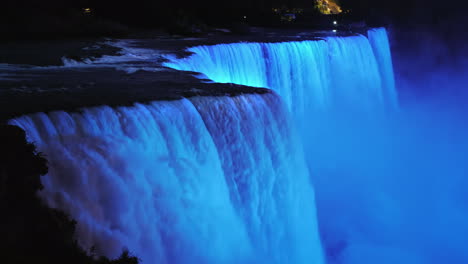 the colorful niagara falls at dusk brightly illuminated by spotlights 4k video