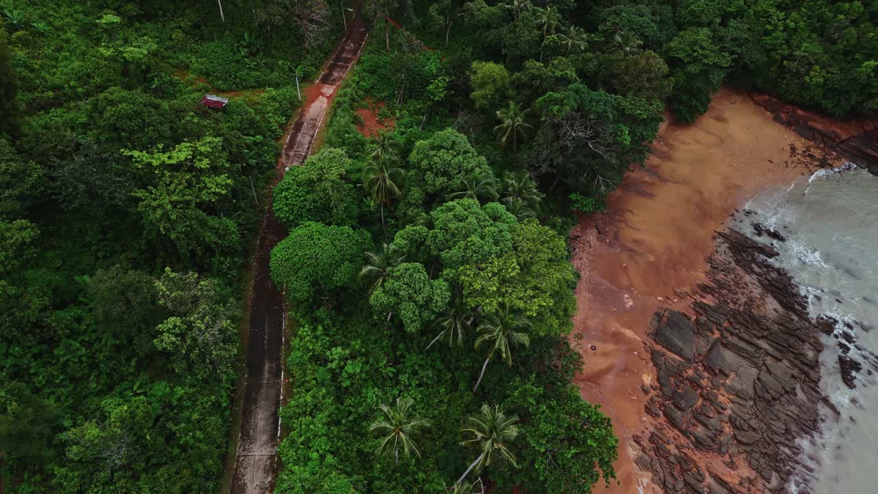Aerial Drone Footage of a Moped on a Coastal Road on a Thai Island