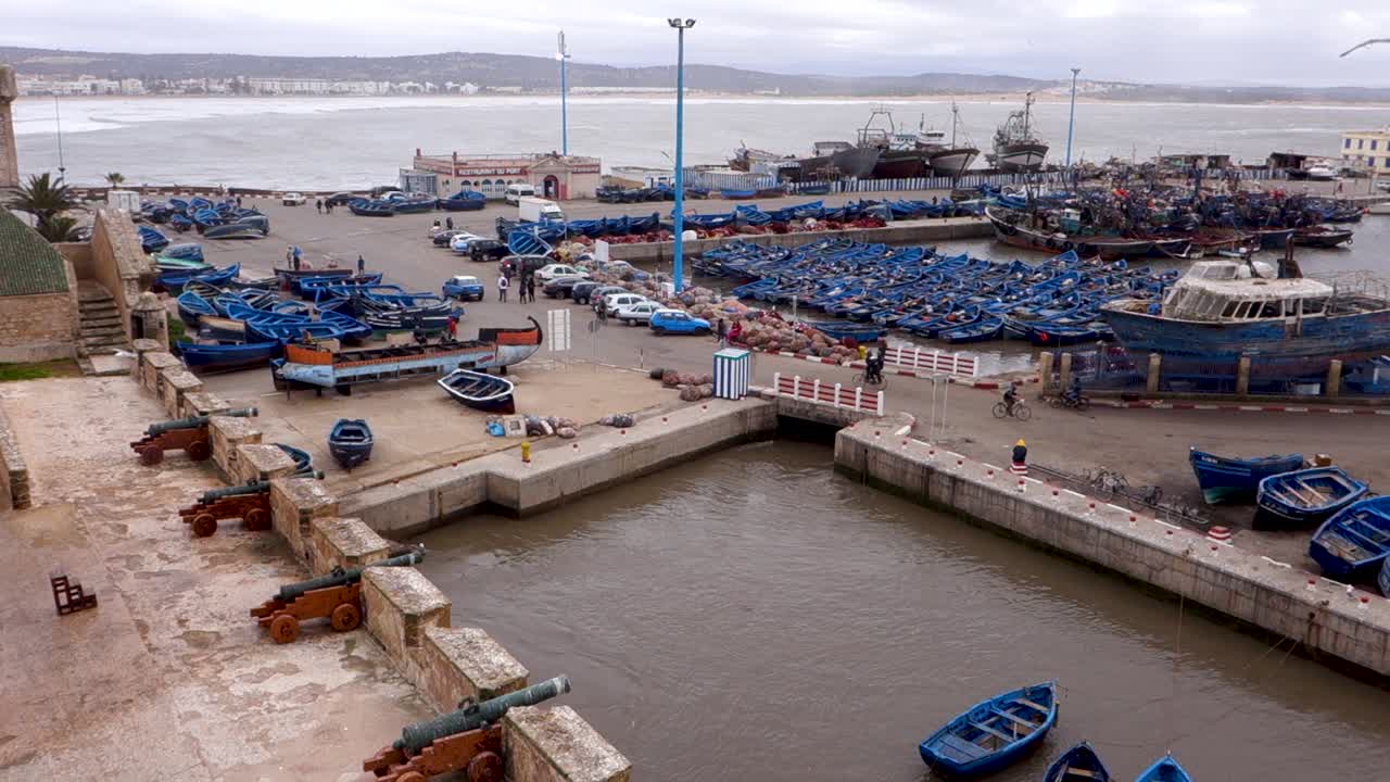 Panning wide angle view to right, elevated, overlooking the port and Atlantic ocean in Essaouira, Morocco