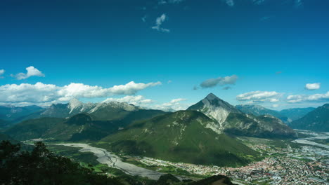 Panorama-time-lapse-of-clouds-casting-shadows-over-alpine-landscape,-Monte-Dobis