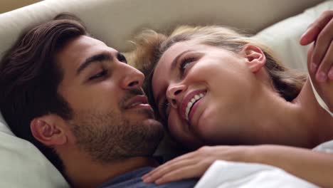 Cute-couple-talking-in-bed