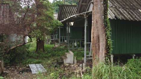 dolly shot of a abandoned derelict destroyed bungalow resort from the effects of covid 19 on tourism