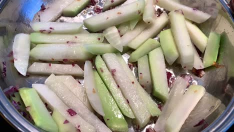 fry kohlrabi and onions in a pan