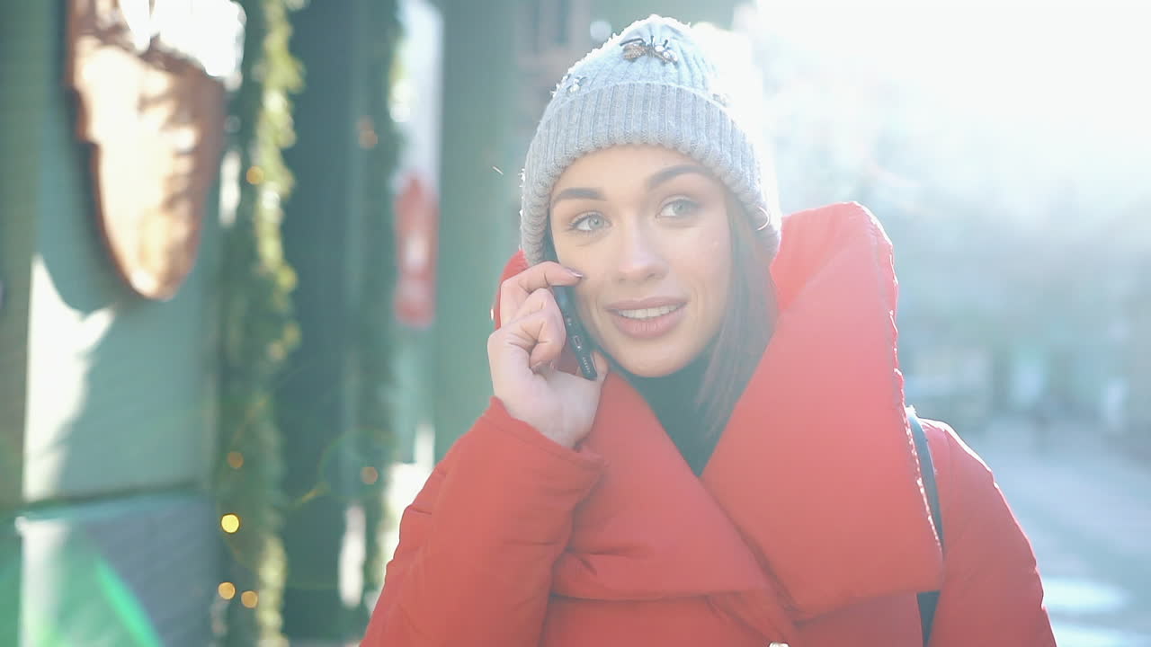 Woman talking on phone in winter