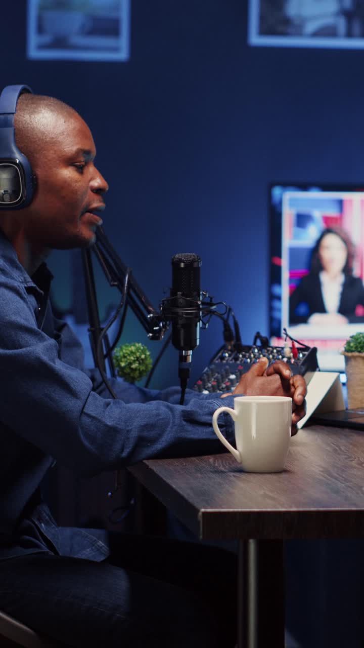 Vertical video Show host recording podcast, enjoying cup of coffee and nice conversation with guest