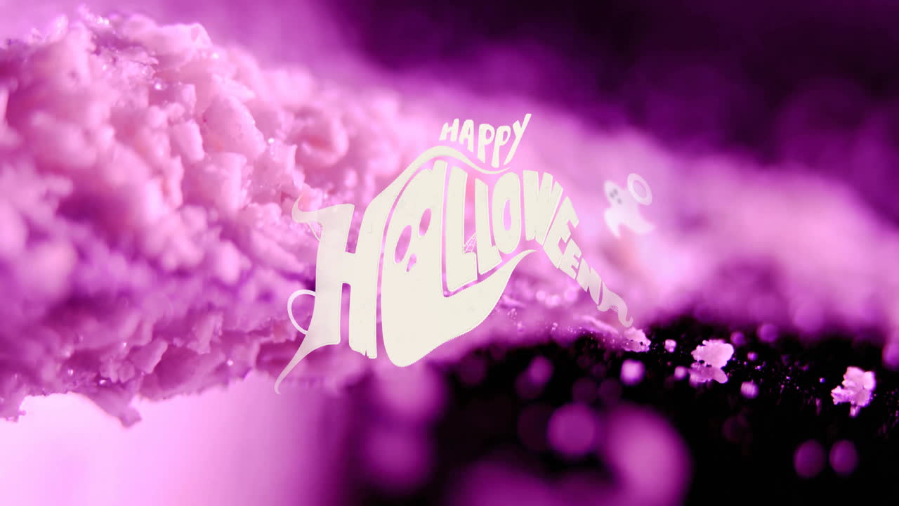 Animation of happy halloween text over pink rocks falling